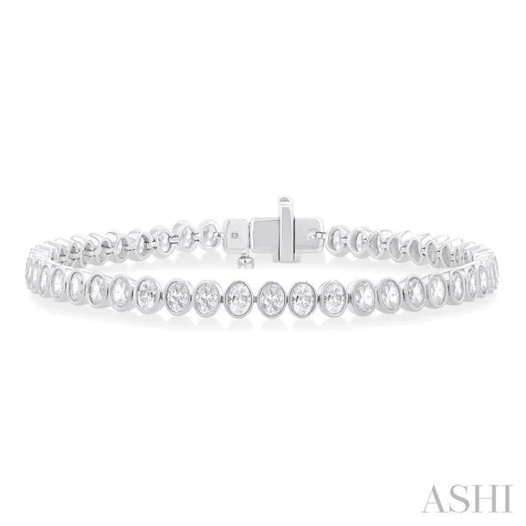 Women’s custom design bracelets-4 1/2 Ctw North-South Bezel Set Oval Cut Diamond Tennis Bracelet in 14K White Gold