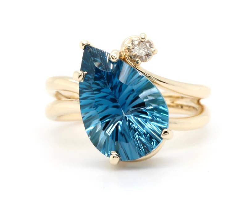 Women’s nature-inspired engagement rings-Offset Curved London Blue Topaz Diamond Gold Ring